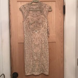 Beautiful beaded cream dress true to size!